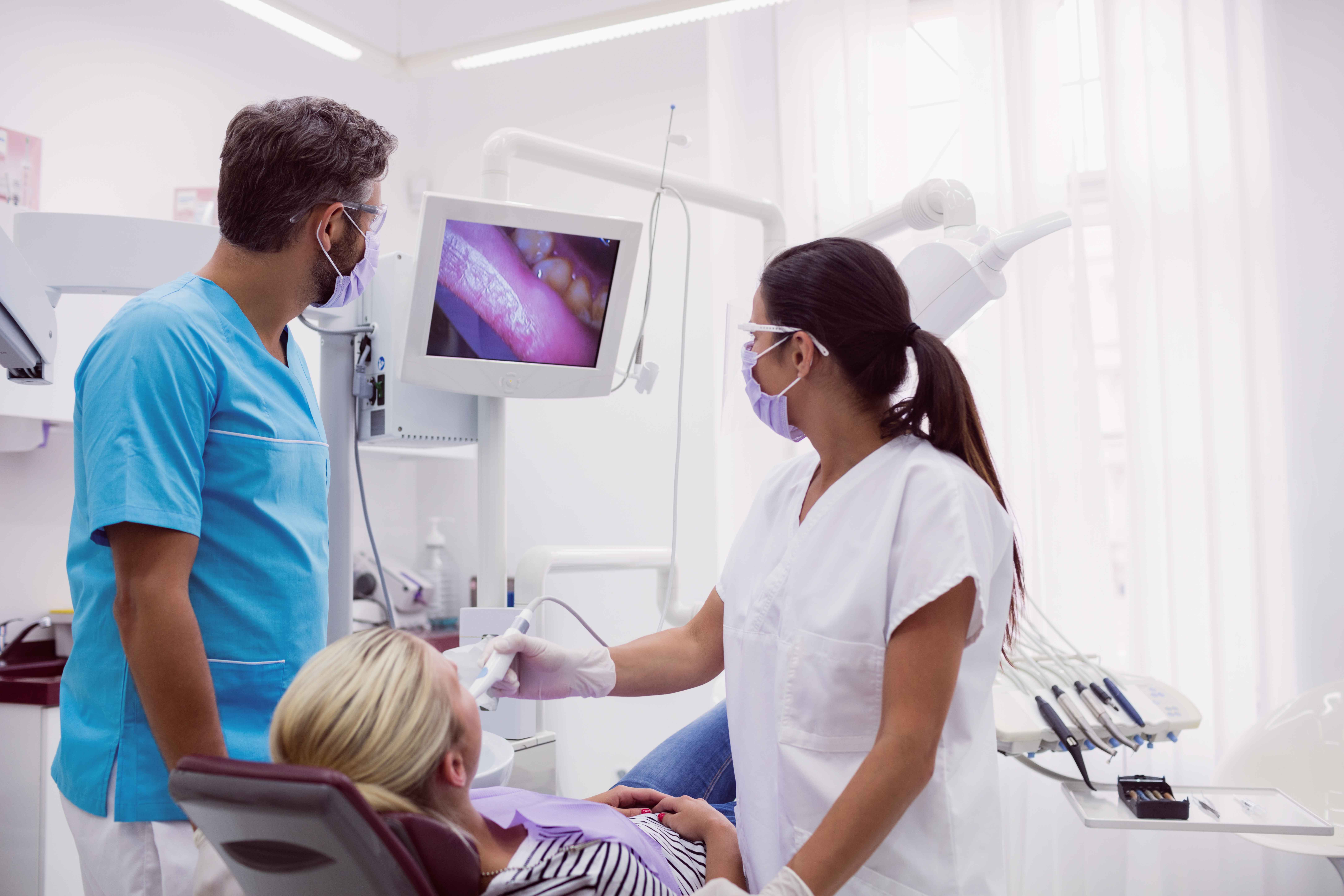 male-female-dentist-examining-patient_11zon.jpg